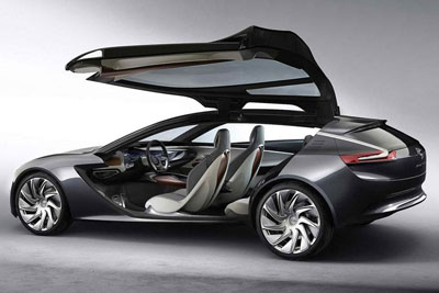 A dark gray concept car with open gull-wing doors